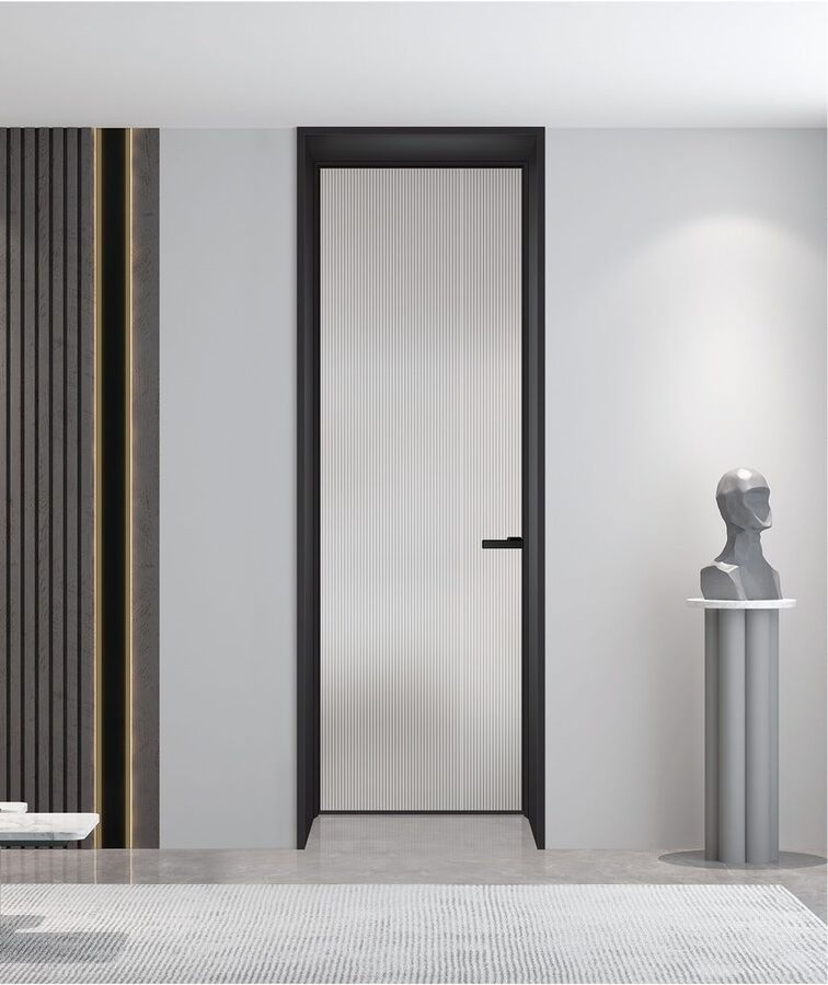 A reeded glass bathroom door in a black frame