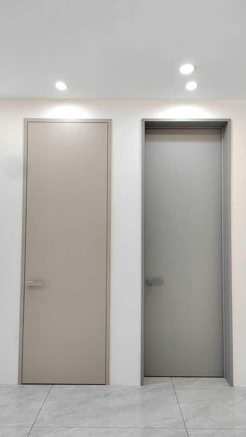 Two doors side by side in two neutral colours