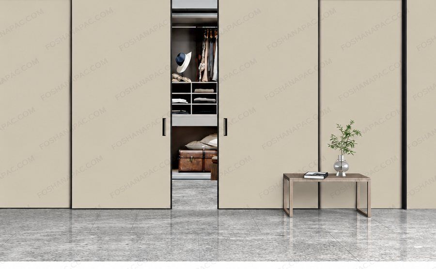 Sliding panels across a wardrobe wall