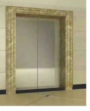 A lift opening wrapped in a stone-effect surround