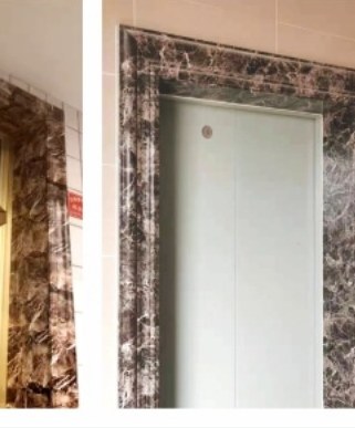 A lift opening in a dark marble-effect surround